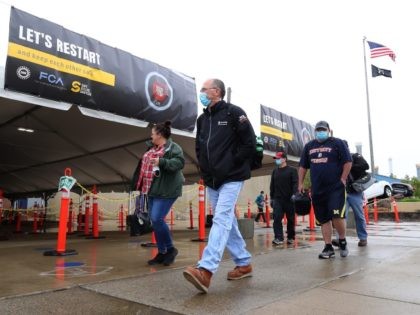 United Auto Workers members leave the Fiat Chrysler Automobiles Warren Truck Plant after t