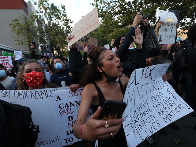 OAKLAND, CALIFORNIA - MAY 29: People march during a protest sparked by the death of George