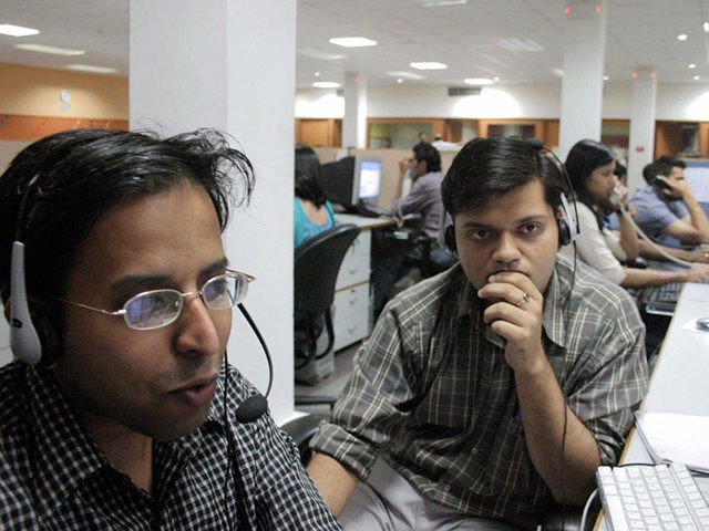 MOHALI, INDIA: TO GO WITH "INDIA-IT-OUTSOURCING" Indian employees of the Quark call center work during their night shift, late 09 May 2005 in Mohali, in India's northern state of Punjab. Bangalore may be better known to people outside of India as the place where customer calls from around the world …