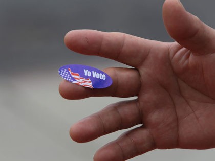 A California primary voter shows the Spanish language I Voted sticker outside a polling station June 7, 2016 in San Diego, California. / AFP / Bill Wechter (Photo credit should read BILL WECHTER/AFP via Getty Images)