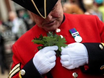 LONDON, ENGLAND - JUNE 07: A Chelsea Pensioner attaches oak leaves to his uniform ahead of the Founder's Day Parade at Royal Hospital Chelsea on June 7, 2018 in London, England. The annual event celebrates the founding of the Royal Hospital Chelsea by King Charles II in 1681. The hospital …