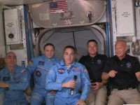 NASA's feed, NASA astronauts Doug Hurley (R) and Bob Behnken (2R) join NASA astronaut Chris Cassidy (C) and Russian cosmonauts, Anatoly Ivanishin (L) and Ivan Vagner (2L) aboard the International Space Station after successfully docking SpaceX's Dragon capsule May 31, 2020.