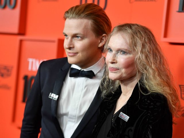 TOPSHOT - Actress Mia Farrow and her son journalist Ronan Farrow arrive on the red carpet