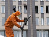 A Russian Emergency Situation worker attends the scene of a fire at St. George Hospital in St. Petersburg, Russia, Tuesday, May 12, 2020. A fire at St. George Hospital has killed five coronavirus patients. Russian emergency officials said all five had been put on ventilators. The emergency officials told the …