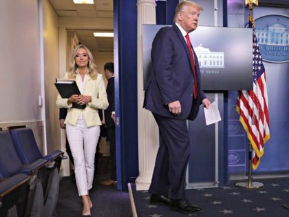 WASHINGTON, DC - MAY 22: U.S. President Donald Trump arrives with White House Press Secretary Kayleigh McEnany to make a statement in the briefing room at the White House on May 22, 2020 in Washington, DC. President Trump announced news CDC guidelines that churches and places of worship are essential …