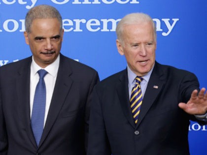 Vice President Joe Biden (R) and Attorney General Eric Holder participate in the Public Safety Officer Medal of Valor award ceremony in the South Court Auditorium at the Eisenhower Executive Office Building February 11, 2015 in Washington, DC. The medal is the highest national award for valor by a public …
