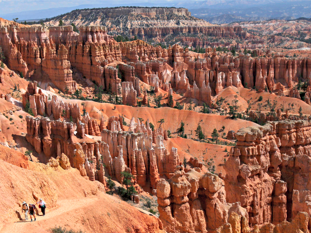 In this Sept. 6, 2009, file photo, hikers make their way to Sunset Point from Thor's Hammer in Bryce Canyon National Park, Utah. Both Zion and Bryce were formed millions of years ago when the Earth's crust violently heaved, leaving behind stunning, unique arrays of rock formations. (AP Photo/Ross D. …