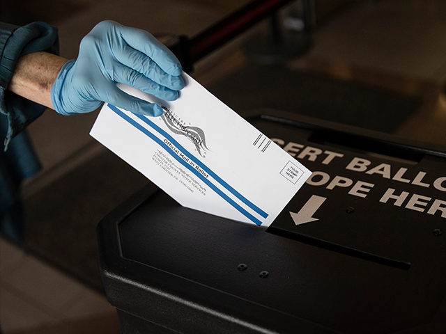 A voter cast her mail-in ballot at in a drop box in West Chester, Pa., prior to the primar