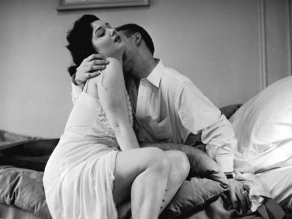circa 1955: An adulterous couple engaged in a passionate embrace. (Photo by Orlando /Three Lions/Getty Images)