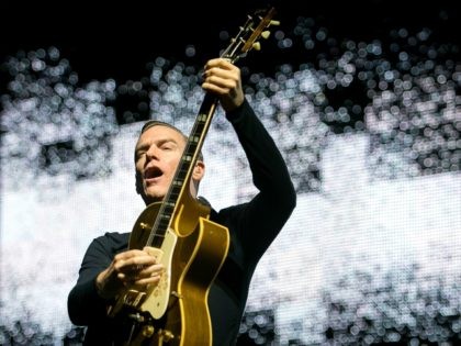 Canadian rock singer,songwriter and guitarist Bryan Adams performs during his concert in Papp Laszlo Budapest Sportsarena in Budapest, Hungary, Sunday night, July 29, 2012. (AP Photo/MTI, Balazs Mohai)