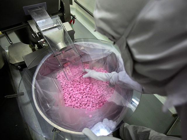 A chemist is seen working in a lab where medicines are being produced at a Cipla manufacturing unit on the outskirts of Mumbai, India, Thursday, Feb 9, 2012. Efforts by India and the European Union to strengthen trade are threatening India's ability to deliver life-saving medicines to the world's poorest, …