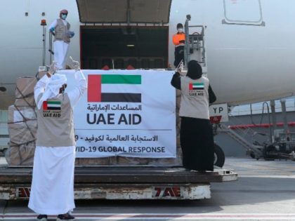 In this Tuesday, May 19, 2020 photo released by the state-run WAM news agency, an Etihad Airways flights loaded with aid for the Palestinians to fight the coronavirus pandemic is loaded in Abu Dhabi, United Arab Emirates. Etihad Airways flew aid for the Palestinians amid the coronavirus pandemic from the …