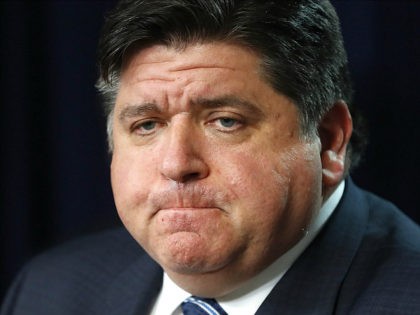 In this March 19, 2020 photo, Illinois Gov. J.B. Pritzker listens to a question during a news conference in Chicago. Amid an unprecedented public health crisis, the nation’s governors are trying to get what they need from the federal government – and fast. But often that means navigating the disorienting …