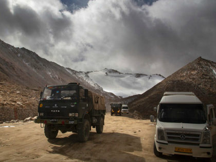 In this Sept. 14, 2018, photo, an Indian Army truck crosses Chang la pass near Pangong Lake in Ladakh region, India. Indian and Chinese soldiers are in a bitter standoff in the remote and picturesque Ladakh region, with the two countries amassing soldiers and machinery near the tense frontier, Indian …