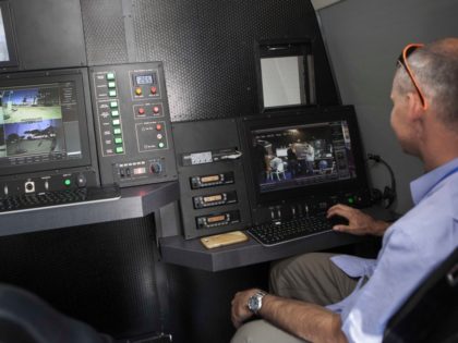A representative of an Israeli company demonstrates a mobile command and control station hidden in a truck during an expo of Israeli intelligence-gathering technology in Tel Aviv, Israel, Tuesday, June 30, 2015. An exhibition of Israeli surveillance technology has offered a rare peek into the secretive world of Israeli espionage …