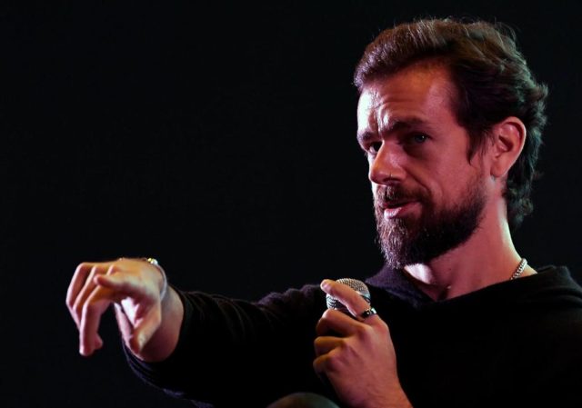 Twitter CEO and co-founder Jack Dorsey gestures while interacting with students at the Ind