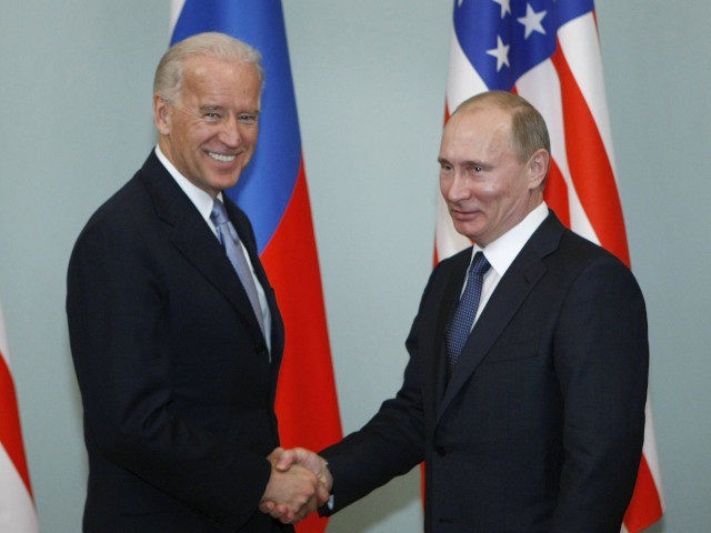 Vice President of the United States Joe Biden, left, shakes hands with Russian Prime Minister Vladimir Putin in Moscow, Russia, Thursday, March 10, 2011. The talks in Moscow are expected to focus on missile defense cooperation and Russia's efforts to join the World Trade Organization. (AP Photo/Alexander Zemlianichenko)
