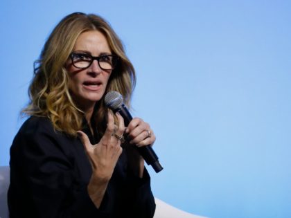 #PassTheMic Julia Roberts speaks during an event for the Obama Foundation in Kuala Lumpur, Malaysia, Thursday, Dec. 12, 2019. Former first lady Michelle Obama and Roberts attended the inaugural Gathering of Rising Leaders in the Asia Pacific organized by the Obama Foundation. (AP Photo/Vincent Thian)