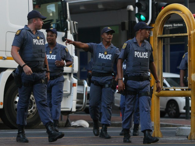 Police patrol the area near parliament in Cape Town, South Africa as South African Preside