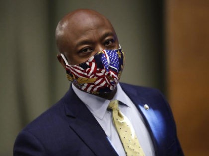 Sen. Tim Scott, R-S.C., wears a face mask as he arrives for a Senate Health Education Labor and Pensions Committee hearing on new coronavirus tests on Capitol Hill in Washington, Thursday, May 7, 2020. (AP Photo/Andrew Harnik, Pool)