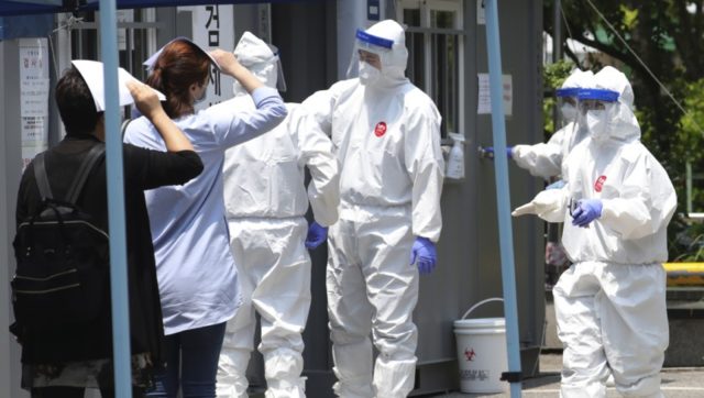 People suspected of being infected with the new coronavirus wait to receive tests at a coronavirus screening station in Bucheon, South Korea, Thursday, May 28, 2020. South Korea on Thursday reported its biggest jump in coronavirus cases in more than 50 days, a setback that could erase some of its …