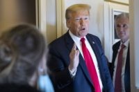 President Donald Trump, with House Minority Leader Kevin McCarthy of Calif., speaks with reporters while in air en route to Andrews Air Force Base Saturday, May 30, 2020, in flight. (AP Photo/Alex Brandon)
