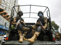 Paramilitary soldiers patrol near the Pakistan Stock Exchange building in Karachi following an attack by Baloch separatists