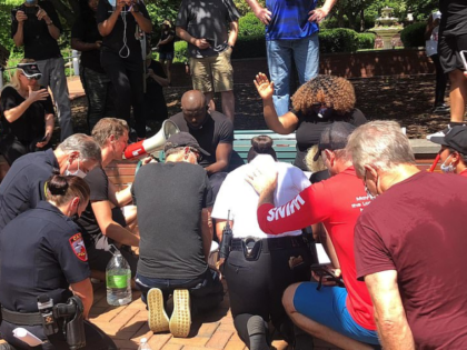 White Police Officers Wash Black Faith Leaders’ Feet During Unity Walk in North Carolina