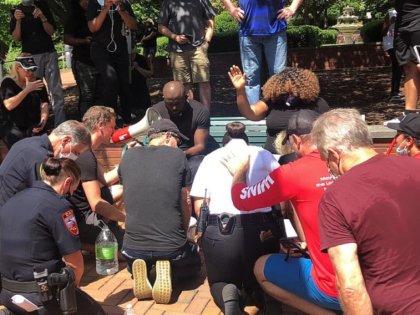 The feet-washing event was part of a walk in Cary, North Carolina, to protest the death of