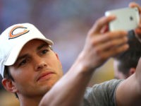 RIO DE JANEIRO, BRAZIL - JULY 13: Actor Ashton Kutcher takes a selfie prior to the 2014 FIFA World Cup Brazil Final match between Germany and Argentina at Maracana on July 13, 2014 in Rio de Janeiro, Brazil. (Photo by Robert Cianflone/Getty Images)
