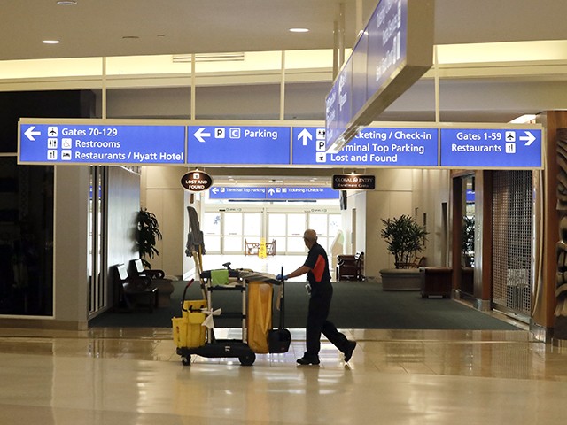 An airport employees pushes a cleaning cart through the terminal at Orlando International Airport after it was closed due to the anticipated arrival of Hurricane Dorian on the East Coast Tuesday, Sept. 3, 2019, in Orlando, Fla. (AP Photo/John Raoux)