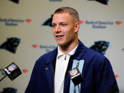 Carolina Panthers running back Christian McCaffrey (22) speaks to members of the media following an NFL football game against the New Orleans Saints in Charlotte, N.C., Sunday, Dec. 29, 2019. (AP Photo/Mike McCarn)