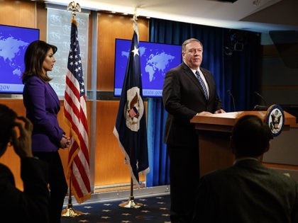Secretary of State Mike Pompeo, next to State Department spokeswoman Morgan Ortagus, left,