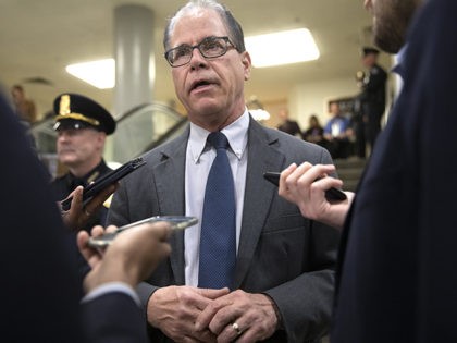 Sen. Mike Braun, R-Ind., arrives on Capitol Hill in Washington, Monday, Feb. 3, 2020, for the impeachment trial of President Donald Trump on charges of abuse of power and obstruction of Congress. (AP Photo/Jacquelyn Martin)