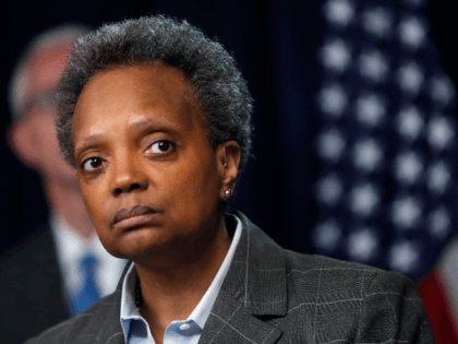 Chicago mayor Lori Lightfoot listens to a question after Illinois Gov. J.B. Pritzker announced a shelter in place order to combat the spread of the Covid-19 virus, during a news conference Friday, March 20, 2020, in Chicago. (AP Photo/Charles Rex Arbogast)