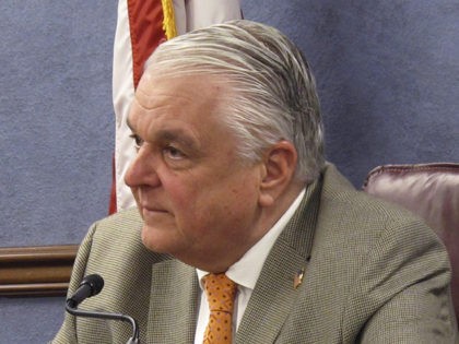 FILE - In this May 7, 2020, file photo, Nevada Gov. Steve Sisolak listens to a reporter's