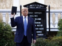President Donald Trump holds a Bible as he visits outside St. John's Church across Lafayette Park from the White House Monday, June 1, 2020, in Washington. Part of the church was set on fire during protests on Sunday night. (AP Photo/Patrick Semansky)