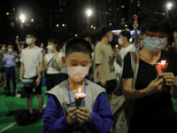 Participants holds candles during a vigil for the victims of the 1989 Tiananmen Square Massacre at Victoria Park in Causeway Bay, Hong Kong, Thursday, June 4, 2020, despite applications for it being officially denied. China is tightening controls over dissidents while pro-democracy activists in Hong Kong and elsewhere try to …
