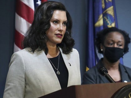 In a pool photo provided by the Michigan Office of the Governor, Michigan Gov. Gretchen Whitmer addresses the state during a speech in Lansing, Mich., Wednesday, June 17, 2020. The governor says she is optimistic about a return to in-person instruction at K-12 schools in the fall, announcing she will …