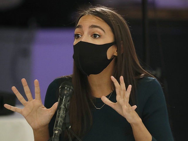 U.S. Rep. Alexandria Ocasio-Cortez, D, New York, makes a point during a debate againsy opponent Michelle Caruso-Cabrera ahead of New York's June 23 primary, Wednesday, June 17, 2020, in the Bronx borough of New York. The even was broadcast on Facebook live. (AP Photo/Kathy Willens)