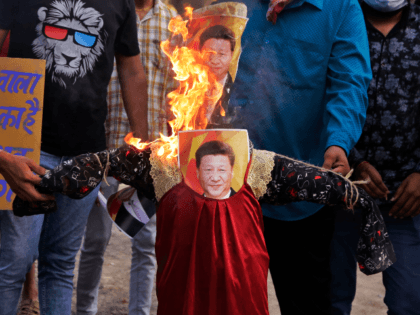Indians burn an effigy of Chinese President Xi Jinping during a protest against China in Ahmedabad, India, Thursday, June 18, 2020. Twenty Indian troops were killed in a clash with Chinese soldiers in the Galwan Valley area Monday night that was the deadliest conflict between the sides in 45 years. …