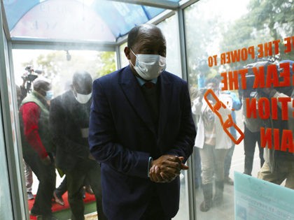 Zimbabwe's Health minister, Obadiah Moyo, arrives at court in Harare, Saturday June 20, 20