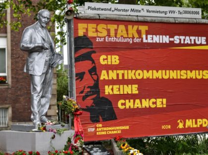 A controversial Lenin statue is pictured beside a poster reading "Don't give anti-communism a chance" in Gelsenkirchen, Germany, on Sunday, June 21, 2020. The statue of the former Soviet leader has been unveiled yesterday by the tiny Marxist-Leninist party MLPD, the installation comes amid global protests against monuments to controversial …