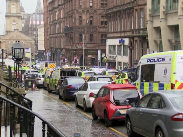 In this image taken from SKY video, emergency services attend the scene of incident in Glasgow, Scotland, Friday June 26, 2020. Police in Glasgow say emergency services are currently dealing with an incident in the center of Scotland's largest city and are urging people to avoid the area. (SKY via …