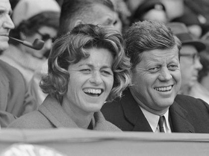 President John Kennedy and his sister, Mrs. Jean Smith, are shown in this candid photo watching the opening base ball game of the American League on April 10, 1961 at Griffith Stadium in Washington. (AP Photo)