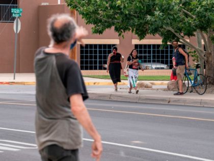 A man who opposed the removal of a statue of conquistador Juan de Onate argues with protesters on June 16, 2020 in Albuquerque, New Mexico after the sculpture of the conquistador was removed. - A man was shot on June 15 as a heavily armed militia group attempted to defend …