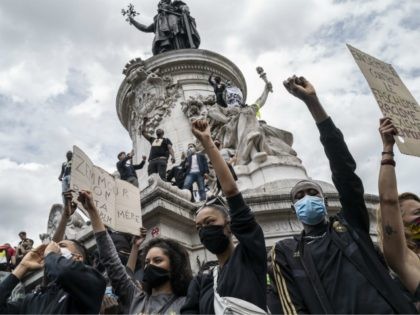 PARIS, FRANCE - JUNE 13: Protesters stand on the monument in Place de la Republique during