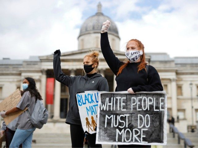 Protesters holding placards attend a demonstration in Trafalgar Square in central London on June 5, 2020, to show solidarity with the Black Lives Matter movement in the wake of the killing of George Floyd, an unarmed black man who died after a police officer knelt on his neck in Minneapolis. …