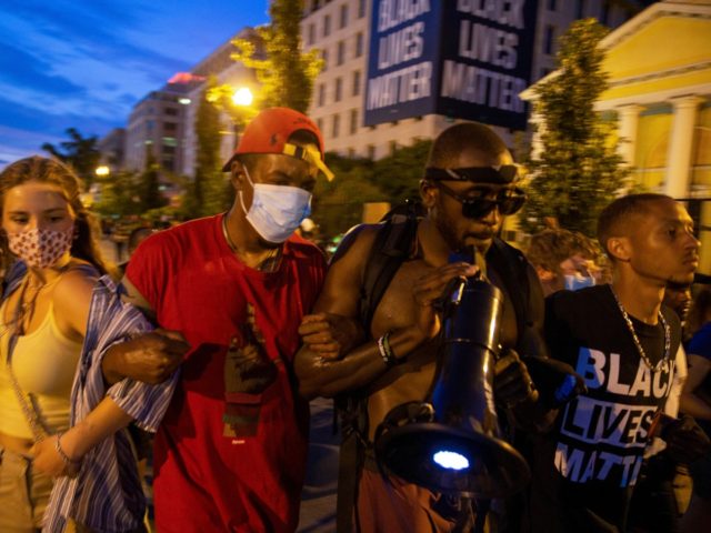 WASHINGTON, DC - JUNE 24: Protesters gather at Black Lives Matter Plaza, after the road was opened back up on June 24, 2020 in Washington, DC. The Trump administration has activated the National Guard to assist D.C. police in protecting monuments during anti-racism protests in Washington. (Photo by Tasos Katopodis/Getty …