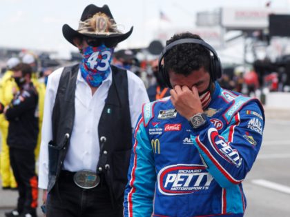 Driver Bubba Wallace, right, is overcome with emotion as he and team owner Richard Petty w